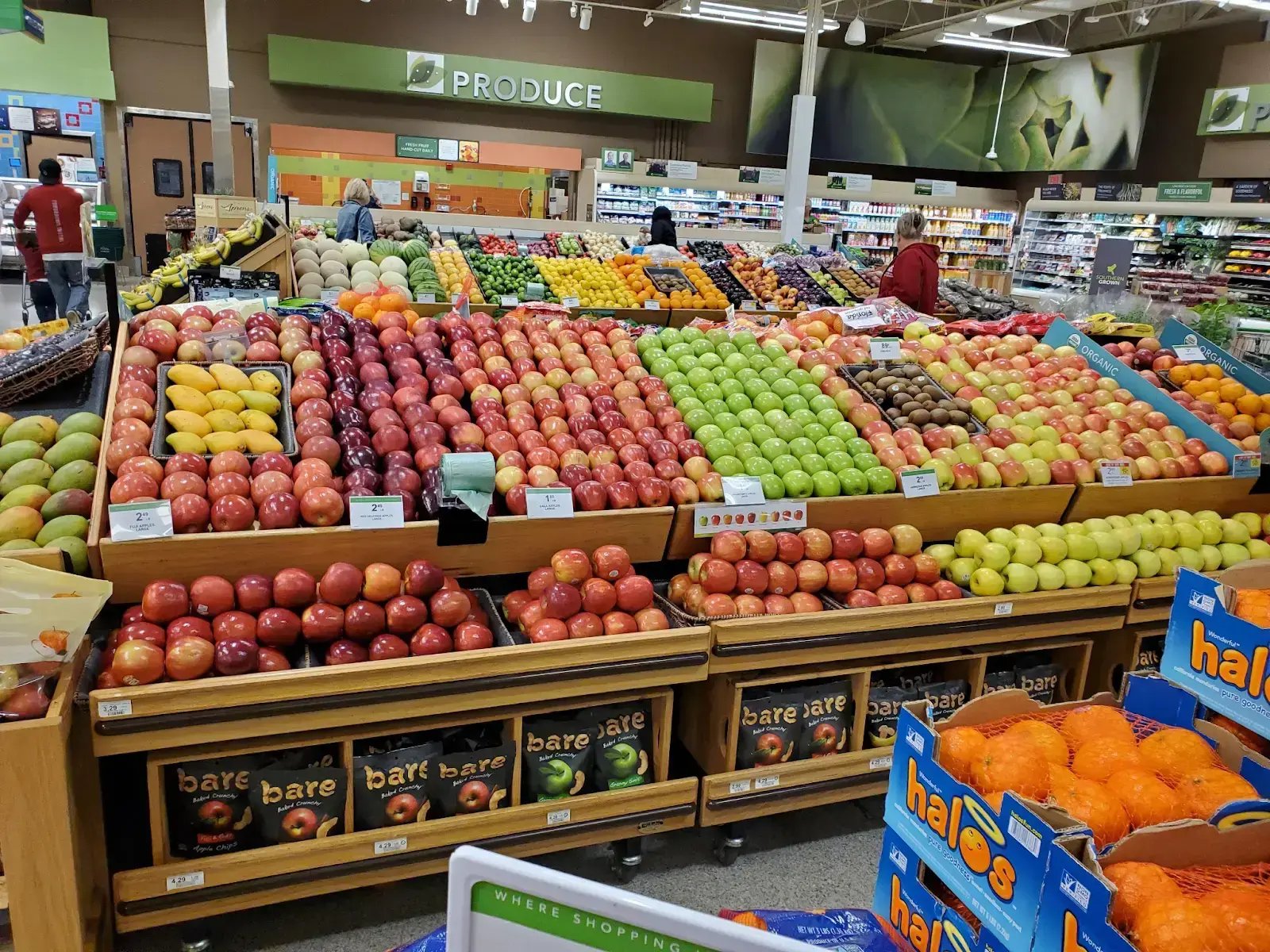 Bins of hand-stacked fresh produce