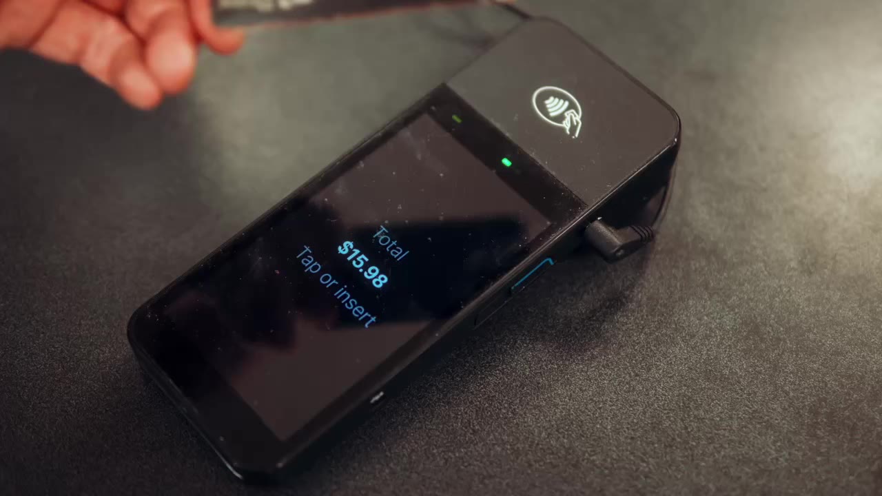 Customer tapping a card on a card reader